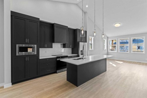 601-15 Coopersfield Link Sw, Airdrie, AB - Indoor Photo Showing Kitchen With Double Sink With Upgraded Kitchen