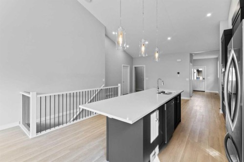 601-15 Coopersfield Link Sw, Airdrie, AB - Indoor Photo Showing Kitchen