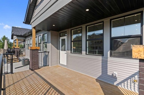 601-15 Coopersfield Link Sw, Airdrie, AB - Outdoor With Deck Patio Veranda With Exterior