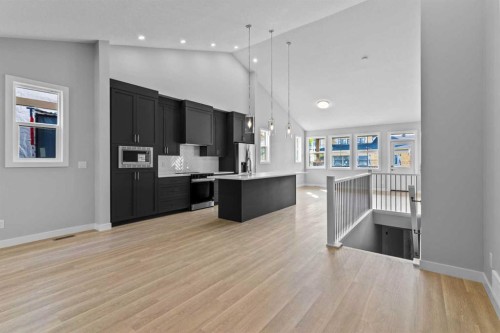 601-15 Coopersfield Link Sw, Airdrie, AB - Indoor Photo Showing Kitchen With Upgraded Kitchen