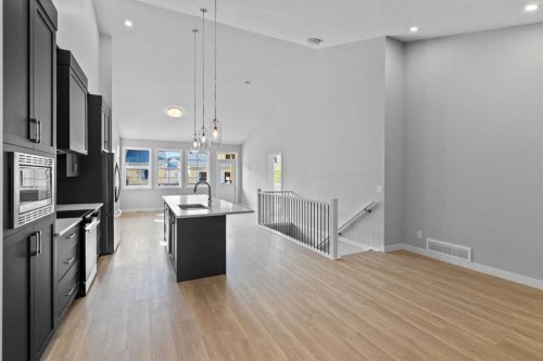 601-15 Coopersfield Link Sw, Airdrie, AB - Indoor Photo Showing Kitchen With Upgraded Kitchen