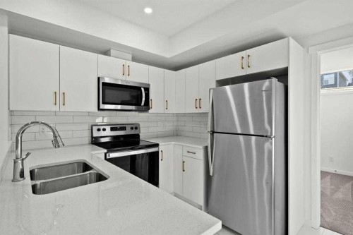 640 Masters Road Se, Calgary, AB - Indoor Photo Showing Kitchen With Stainless Steel Kitchen With Double Sink With Upgraded Kitchen