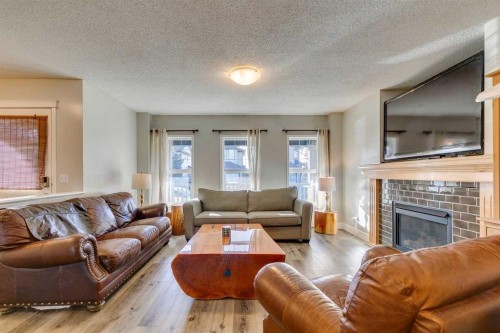 199 Everglen Way Sw, Calgary, AB - Indoor Photo Showing Living Room With Fireplace