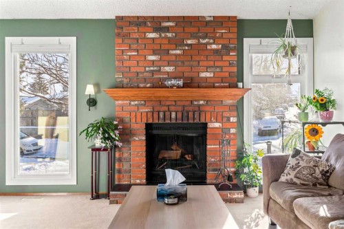 76 Bedford Circle Ne, Calgary, AB - Indoor Photo Showing Living Room With Fireplace