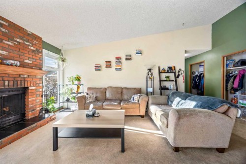 76 Bedford Circle Ne, Calgary, AB - Indoor Photo Showing Living Room With Fireplace