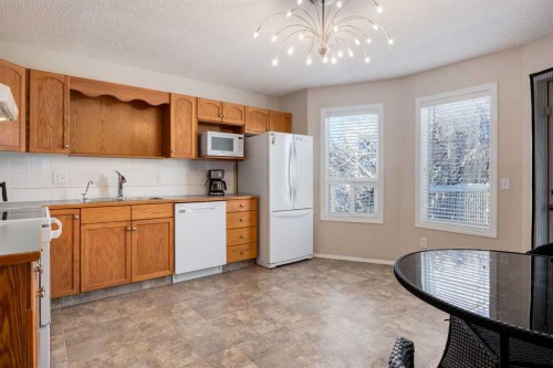 145 Fairway View Nw, High River, AB - Indoor Photo Showing Kitchen With Double Sink