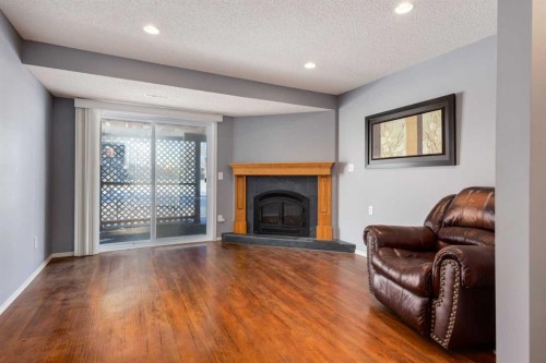 145 Fairway View Nw, High River, AB - Indoor Photo Showing Living Room With Fireplace