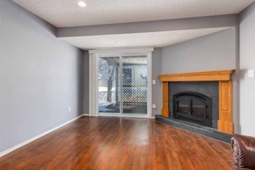 145 Fairway View Nw, High River, AB - Indoor Photo Showing Living Room With Fireplace