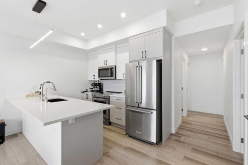 162 Spring Creek Common Sw, Calgary, AB - Indoor Photo Showing Kitchen With Upgraded Kitchen