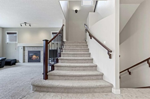 396 Tuscany Estates Rise Nw, Calgary, AB - Indoor Photo Showing Other Room With Fireplace