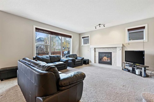 396 Tuscany Estates Rise Nw, Calgary, AB - Indoor Photo Showing Living Room With Fireplace