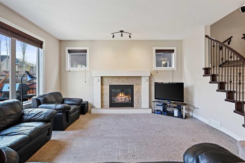 396 Tuscany Estates Rise Nw, Calgary, AB - Indoor Photo Showing Living Room With Fireplace
