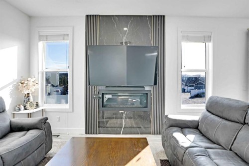32 Redstone Court Ne, Calgary, AB - Indoor Photo Showing Living Room With Fireplace
