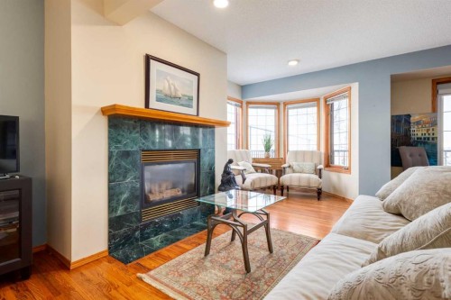 48 Patina Point Sw, Calgary, AB - Indoor Photo Showing Living Room With Fireplace
