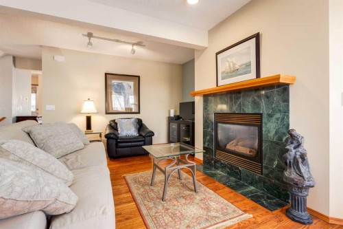 48 Patina Point Sw, Calgary, AB - Indoor Photo Showing Living Room With Fireplace