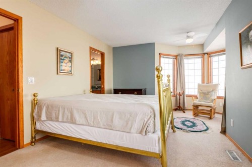 48 Patina Point Sw, Calgary, AB - Indoor Photo Showing Bedroom