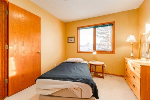 48 Patina Point Sw, Calgary, AB - Indoor Photo Showing Bedroom