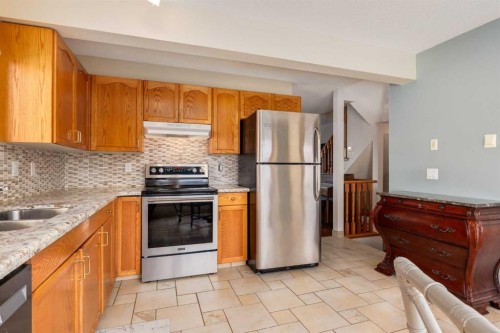 48 Patina Point Sw, Calgary, AB - Indoor Photo Showing Kitchen