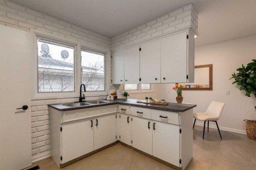 126 & 128 Winston Drive Sw, Calgary, AB - Indoor Photo Showing Kitchen With Double Sink