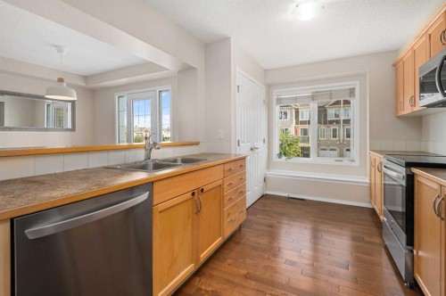 19 Windstone Green Sw, Airdrie, AB - Indoor Photo Showing Kitchen With Double Sink