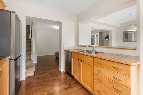 19 Windstone Green Sw, Airdrie, AB - Indoor Photo Showing Kitchen With Double Sink