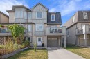 19 Windstone Green Sw, Airdrie, AB  - Outdoor With Balcony With Facade 