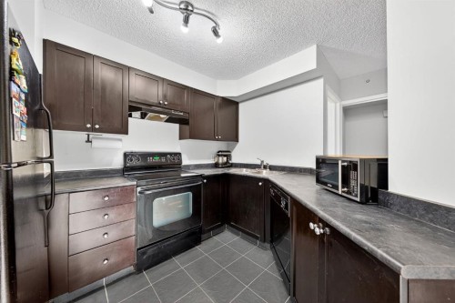 1107-1111 6 Avenue Sw, Calgary, AB - Indoor Photo Showing Kitchen