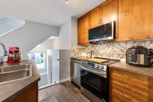243 New Brighton Landing Se, Calgary, AB - Indoor Photo Showing Kitchen With Double Sink