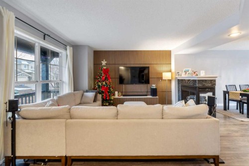 243 New Brighton Landing Se, Calgary, AB - Indoor Photo Showing Living Room With Fireplace