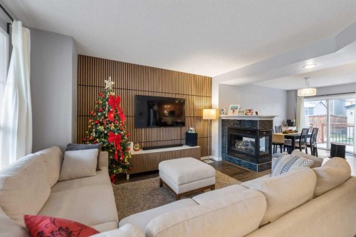 243 New Brighton Landing Se, Calgary, AB - Indoor Photo Showing Living Room With Fireplace