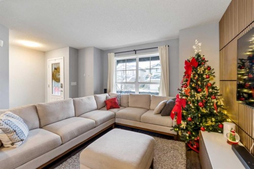243 New Brighton Landing Se, Calgary, AB - Indoor Photo Showing Living Room