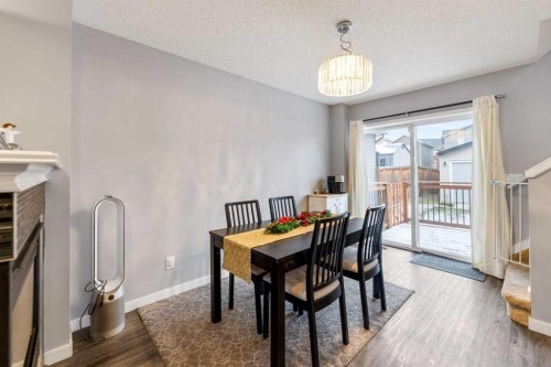 243 New Brighton Landing Se, Calgary, AB - Indoor Photo Showing Dining Room