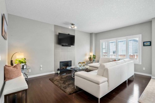 236 Walden Heights Se, Calgary, AB - Indoor Photo Showing Living Room With Fireplace