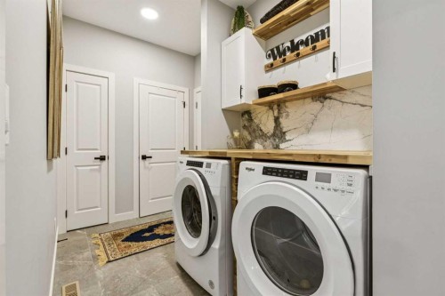 376 Precedence Hill, Cochrane, AB - Indoor Photo Showing Laundry Room