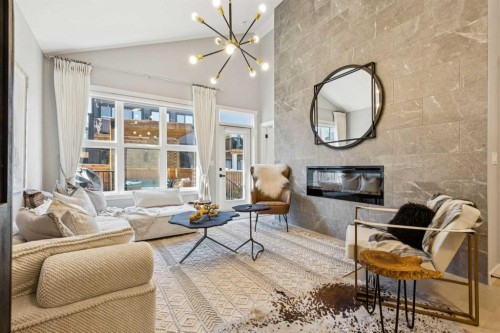 376 Precedence Hill, Cochrane, AB - Indoor Photo Showing Living Room With Fireplace