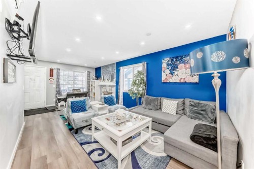 240 Applewood Drive Se, Calgary, AB - Indoor Photo Showing Living Room With Fireplace