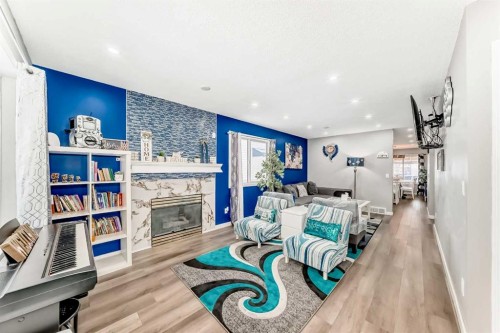 240 Applewood Drive Se, Calgary, AB - Indoor Photo Showing Living Room With Fireplace