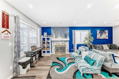 240 Applewood Drive Se, Calgary, AB - Indoor Photo Showing Living Room With Fireplace