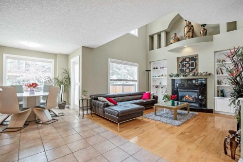 26 Simcrest Manor Sw, Calgary, AB - Indoor Photo Showing Living Room With Fireplace