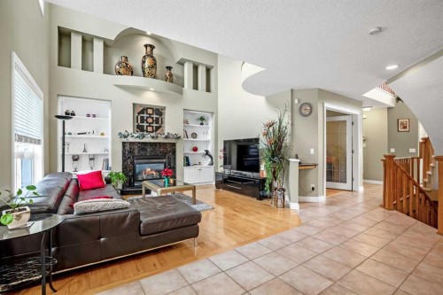 26 Simcrest Manor Sw, Calgary, AB - Indoor Photo Showing Living Room With Fireplace