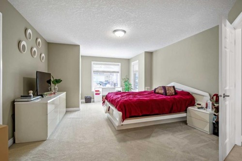 26 Simcrest Manor Sw, Calgary, AB - Indoor Photo Showing Bedroom
