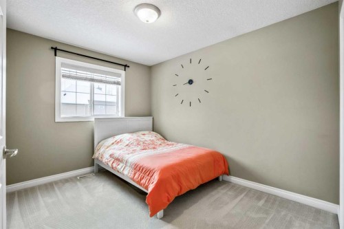 26 Simcrest Manor Sw, Calgary, AB - Indoor Photo Showing Bedroom