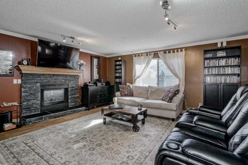 148 Citadel Close Nw, Calgary, AB - Indoor Photo Showing Living Room With Fireplace