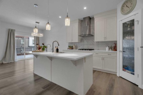 208-- Dawson Harbour Heights, Chestermere, AB - Indoor Photo Showing Kitchen With Upgraded Kitchen