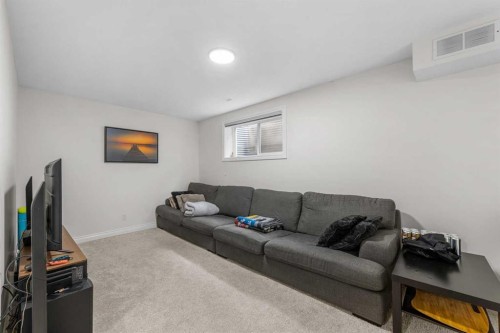 27 Cedarwood Lane Sw, Calgary, AB - Indoor Photo Showing Living Room