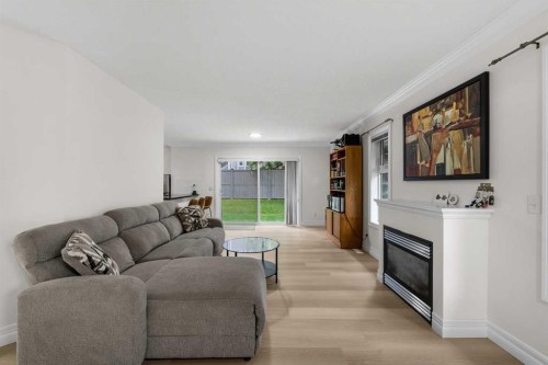 27 Cedarwood Lane Sw, Calgary, AB - Indoor Photo Showing Living Room With Fireplace