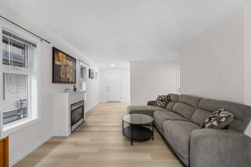 27 Cedarwood Lane Sw, Calgary, AB - Indoor Photo Showing Living Room With Fireplace
