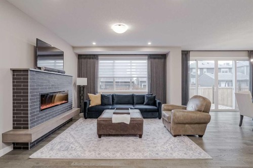 73 Magnolia Terrace Se, Calgary, AB - Indoor Photo Showing Living Room With Fireplace