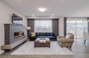 73 Magnolia Terrace Se, Calgary, AB  - Indoor Photo Showing Living Room With Fireplace 