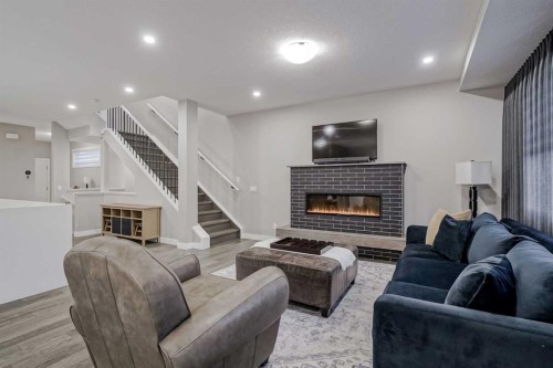 73 Magnolia Terrace Se, Calgary, AB - Indoor Photo Showing Living Room With Fireplace